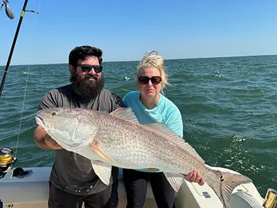 Saltwater fishing tackle and rods ready on charter deck